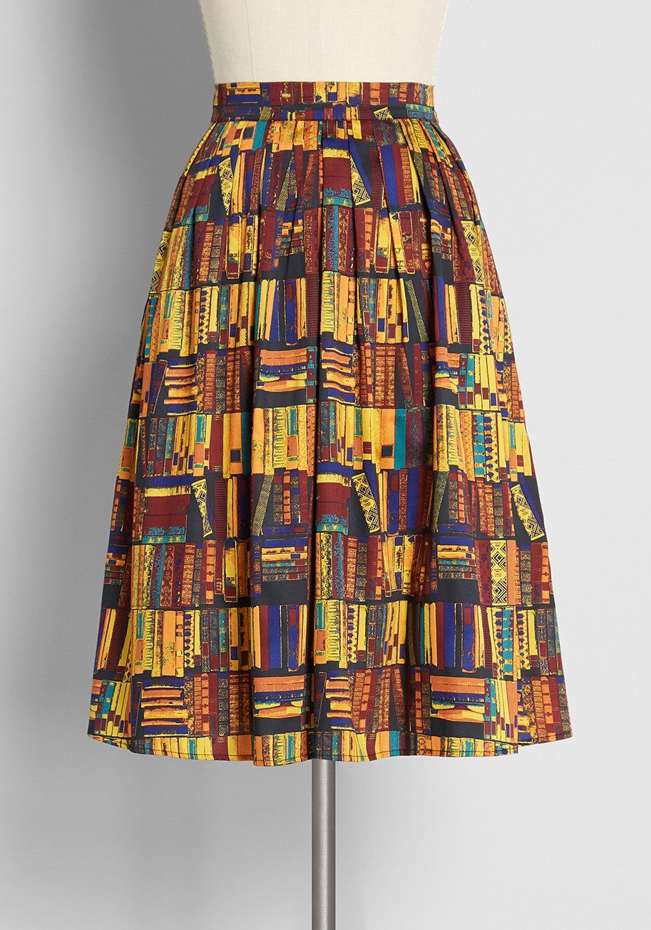 Image of a knee-length skirt covered in old books. 