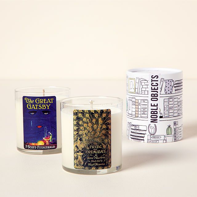 image of three candles. The left candle features the cover from The Great Gatsby. The center candle has the cover from Pride and Prejudice. The final candle says notable objects and features bookshelves. 