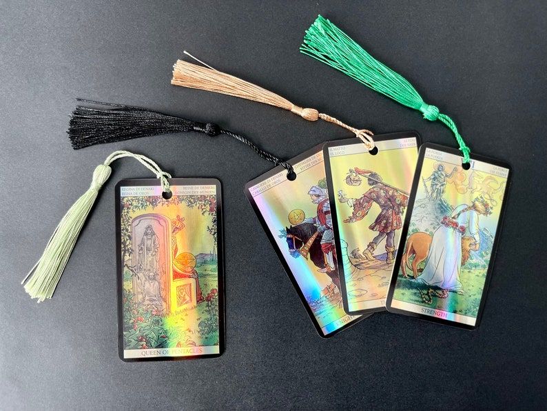 Set of four holographic tarot card bookmarks, each with a tassel. 