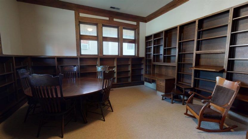 Image of built-in wood bookshelves inside the former library