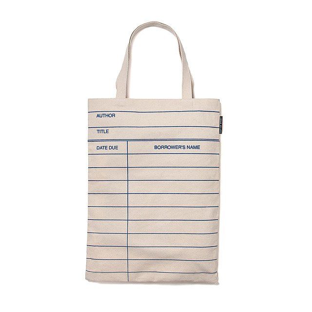 Image of a cream colored tote bag. It's designed like a library date due card. 