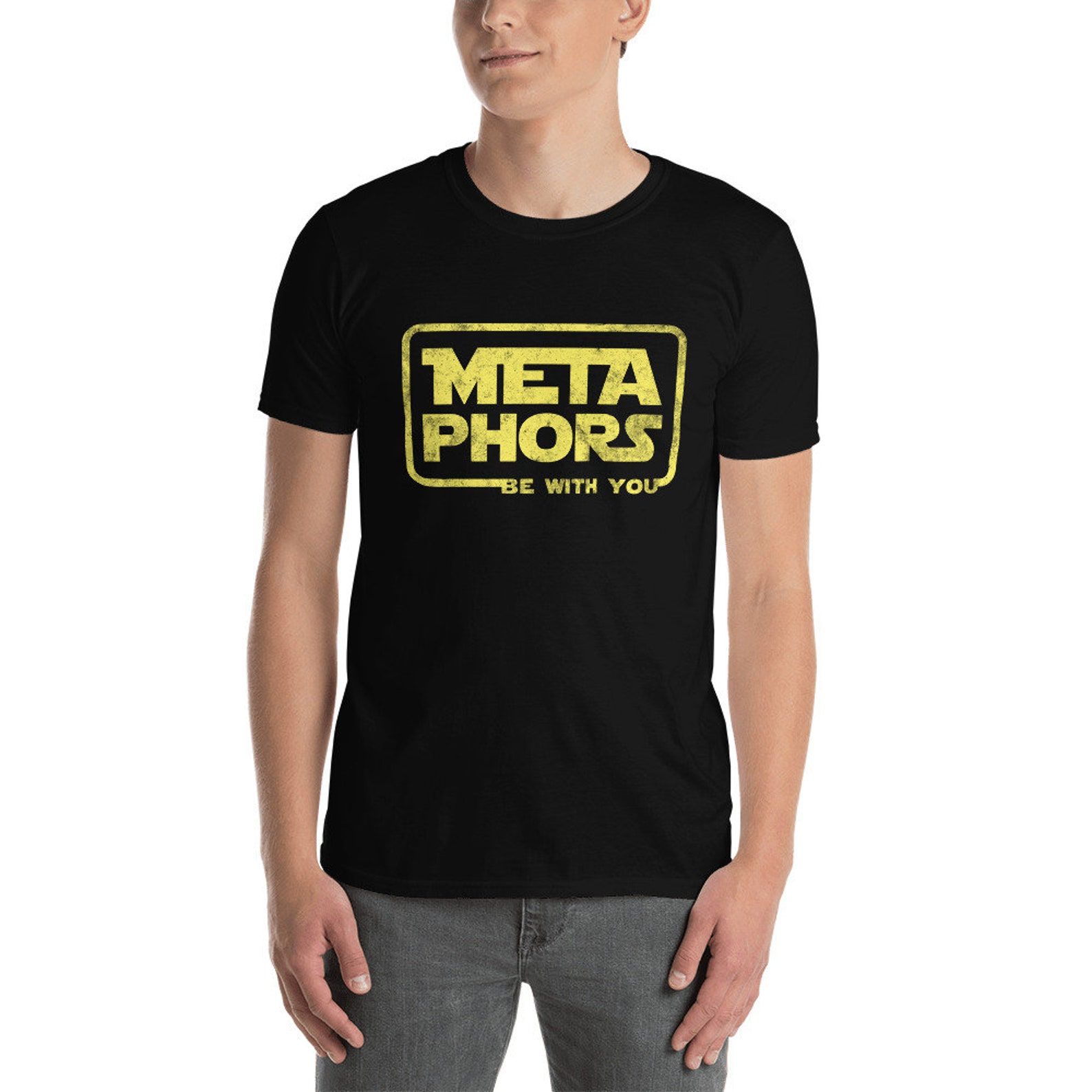 A black t-shirt with the words "Metaphors be with you" styled like the Star Wars logo