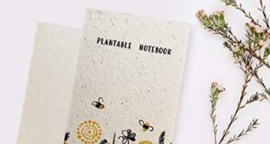 photo of a plantable notebook with flowers beside it