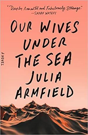cover of Our Wives Under the Sea by Julia Armfield; peach background with rocky ocean bottom terrain at the bottom