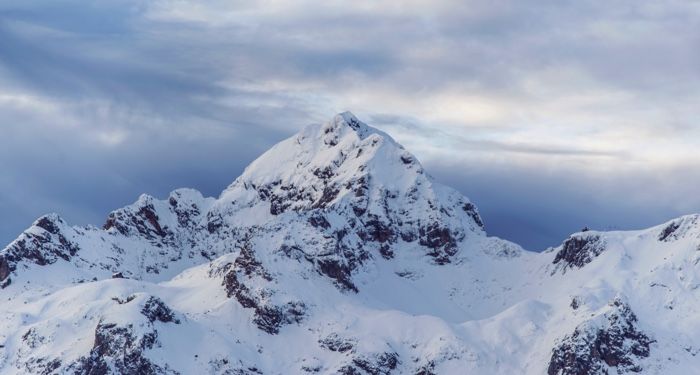snowy alpine peak against a winter sky