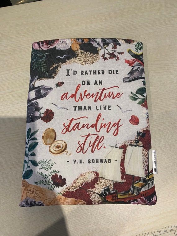 Shades of Magic book sleeve with text "I'd rather die on an adventure than live standing still."