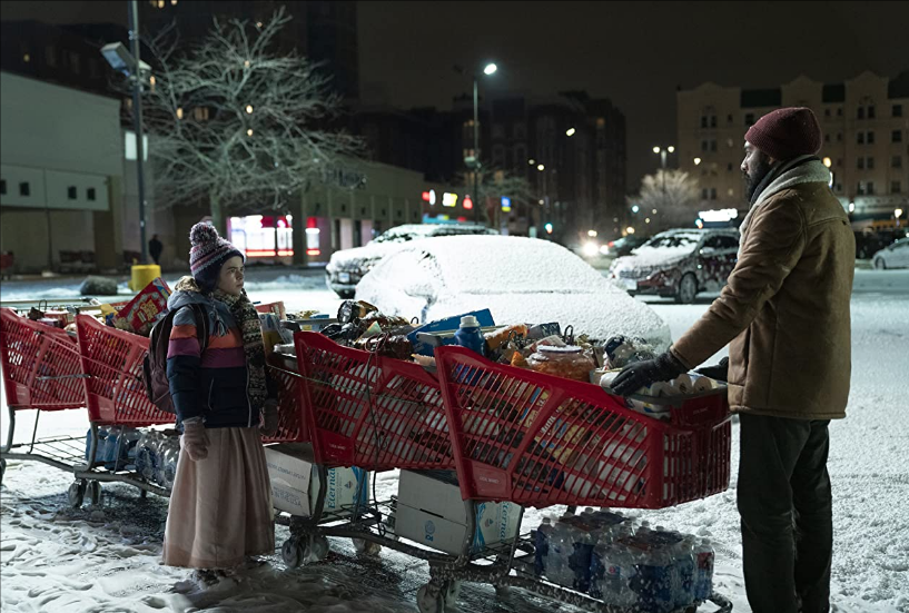 Station-Eleven-HBO-Series-Still-Girl-and-Man-Standing-With-Grocery-Carts
