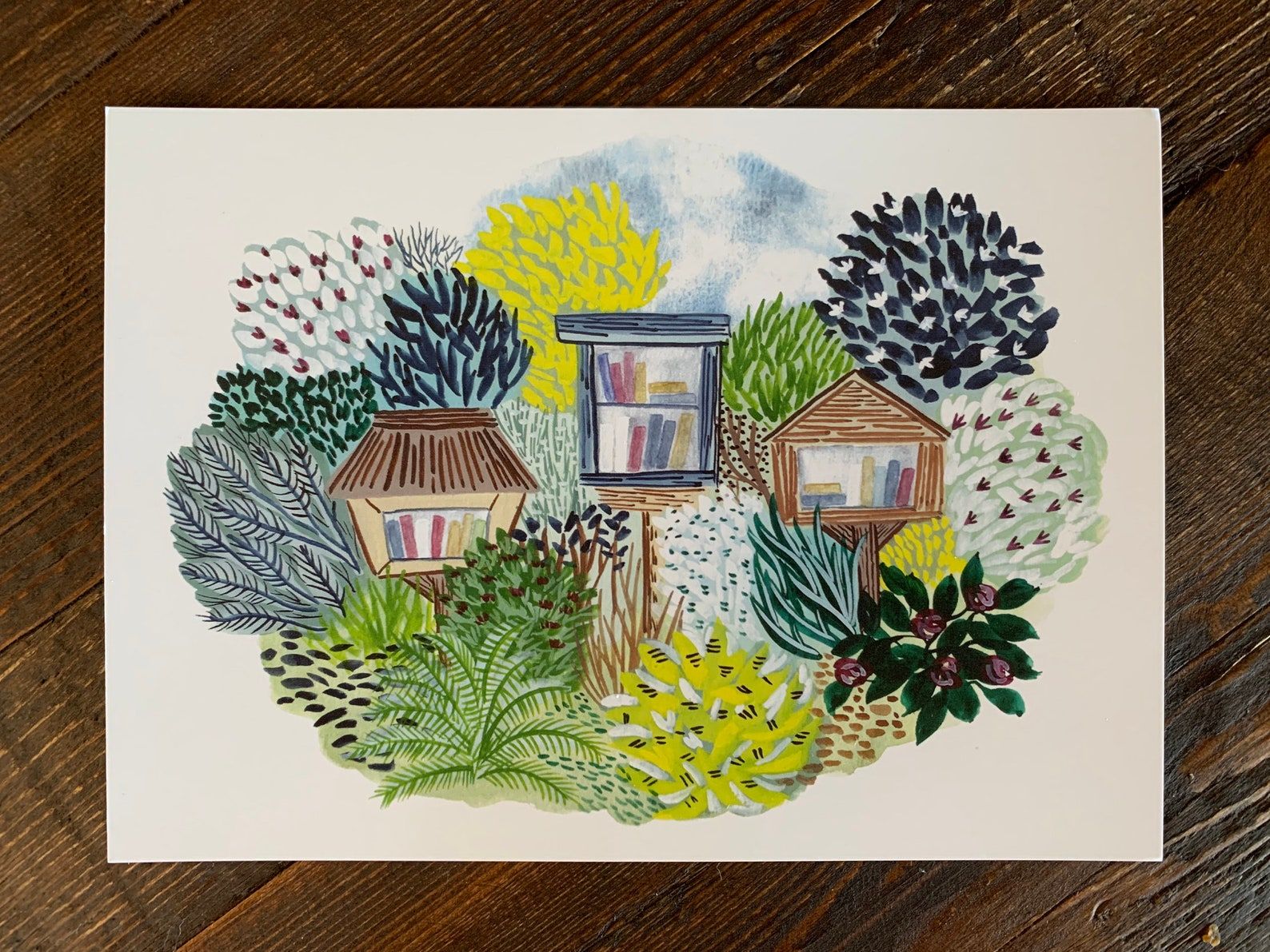 A postcard depicting three LFL's among greenery