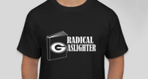a photo of a tee shirt with an illustration of a book and the text radical gaslighter
