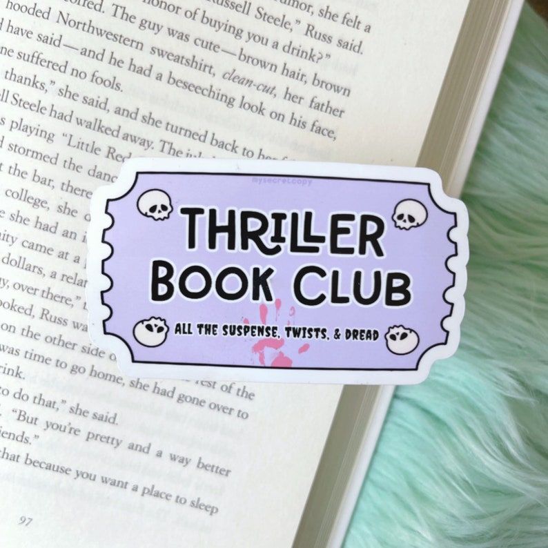 Image of a purple sticker in the shape of a movie ticket stub. It reads "thriller book club: all the suspense, twists, and dread." 