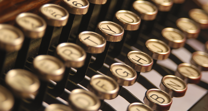 a close up photo of a 1930s typewriter's keys