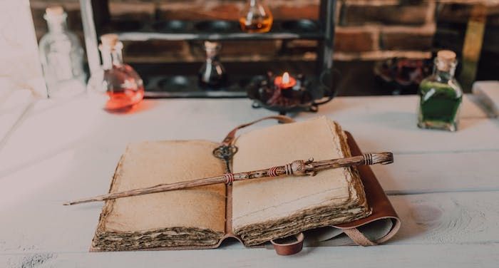 photo of a wand lying on a book