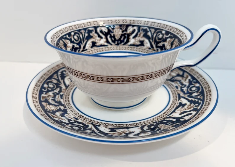 Etsy: An antique teacup featuring dragons in the pattern.