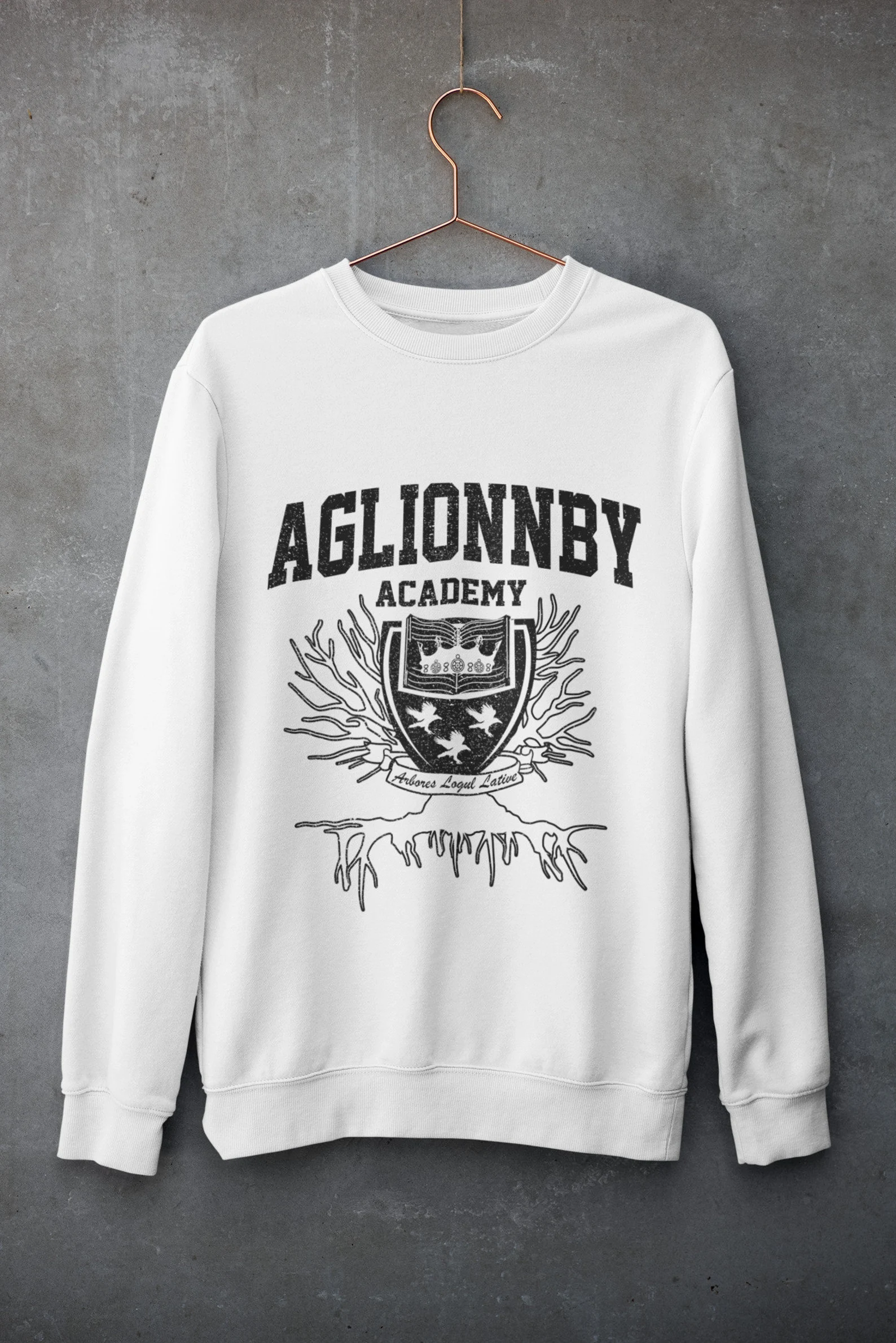 A white sweatshirt with the Aglionby Academy crest