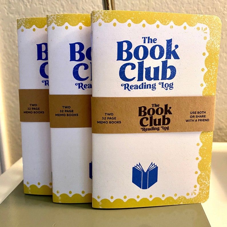 Image of three notebooks that read 'the book club reading log."