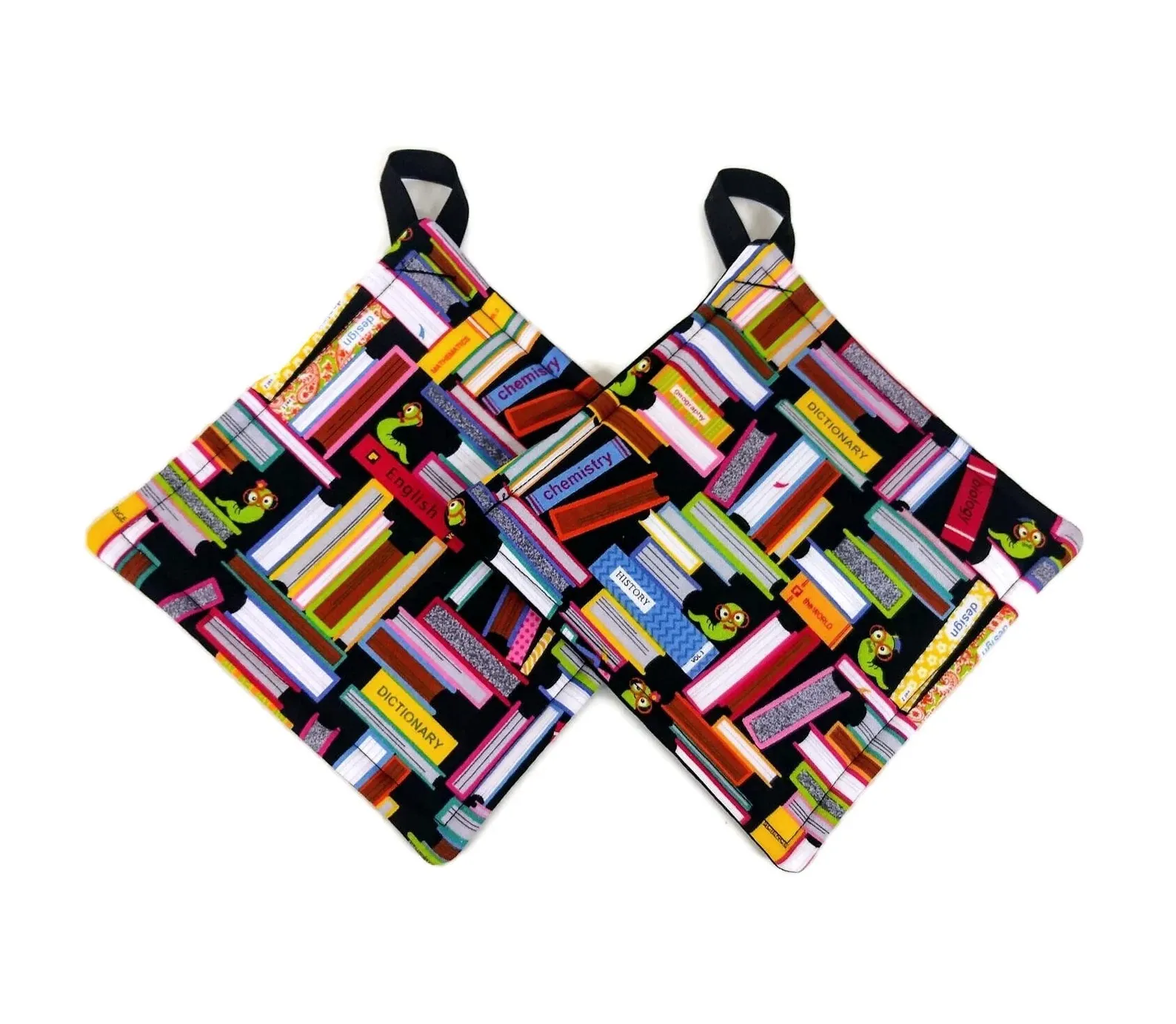 Two square potholders patterned with stacks of books in all shapes and sizes, and a few little green bookworms wearing glasses crawling between the stacks.