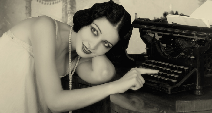 a vintage looking photo of a flapper girl posing with a typewriter