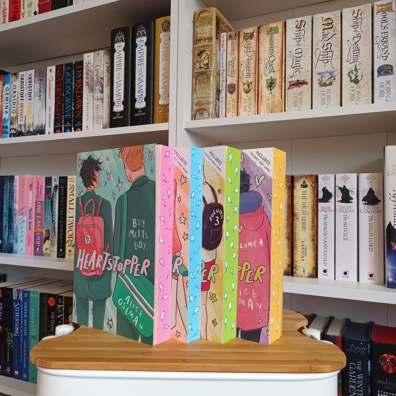 All four Heartstopper books with matching sprayed edges