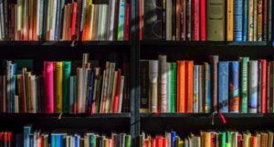 library books on a black bookshelf