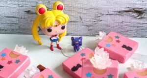 Sailor Moon Funk pop figurine net to six pink bars of vegan Sailor Moon themed soap