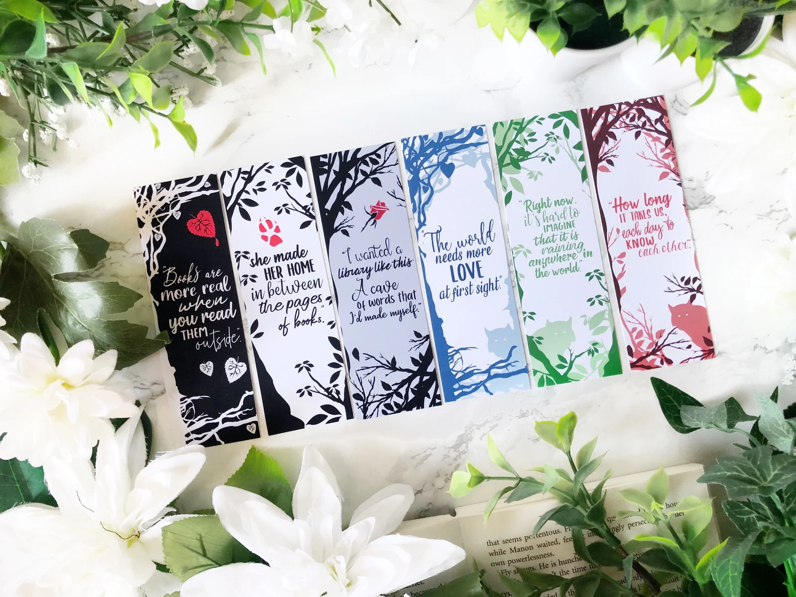 A set of six bookmarks with quotes and cover art from the Shiver trilogy