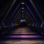 blue and purple light in a triangular tunnel