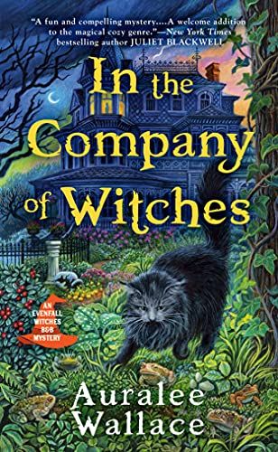 cover of In the Company of Witches by Auralee Wallace, showing a black cat in a garden with a large three-story house behind it