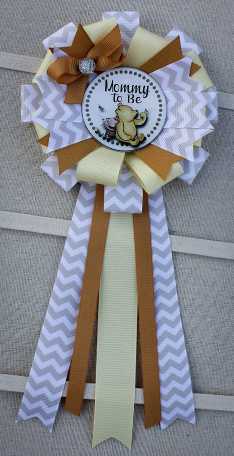 Winnie the Pooh ribbon corsage with "Mommy to be" in text