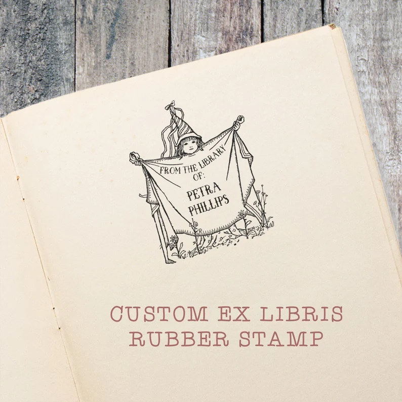 Image of a custom book stamp. It features a child in a magical hat and cape. 