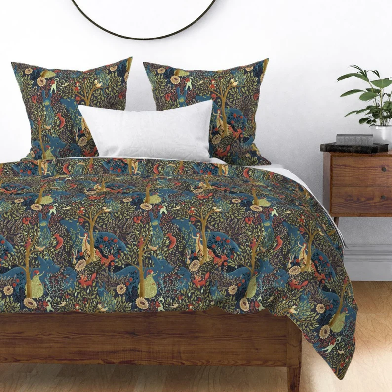 Image of a dreamy, woodsy fairy tale scene printed on a duvet and pillows. 