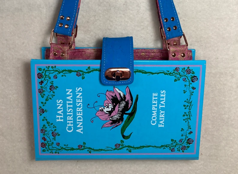 Image of a blue purse made from an edition of Hans Christian Andersen's Complete Fairy Tales