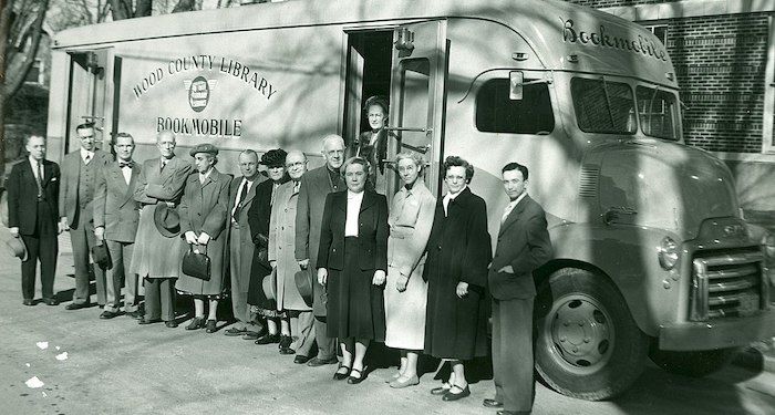 black and white photo of Wood County Library Bookmobile from 1951 with people outside