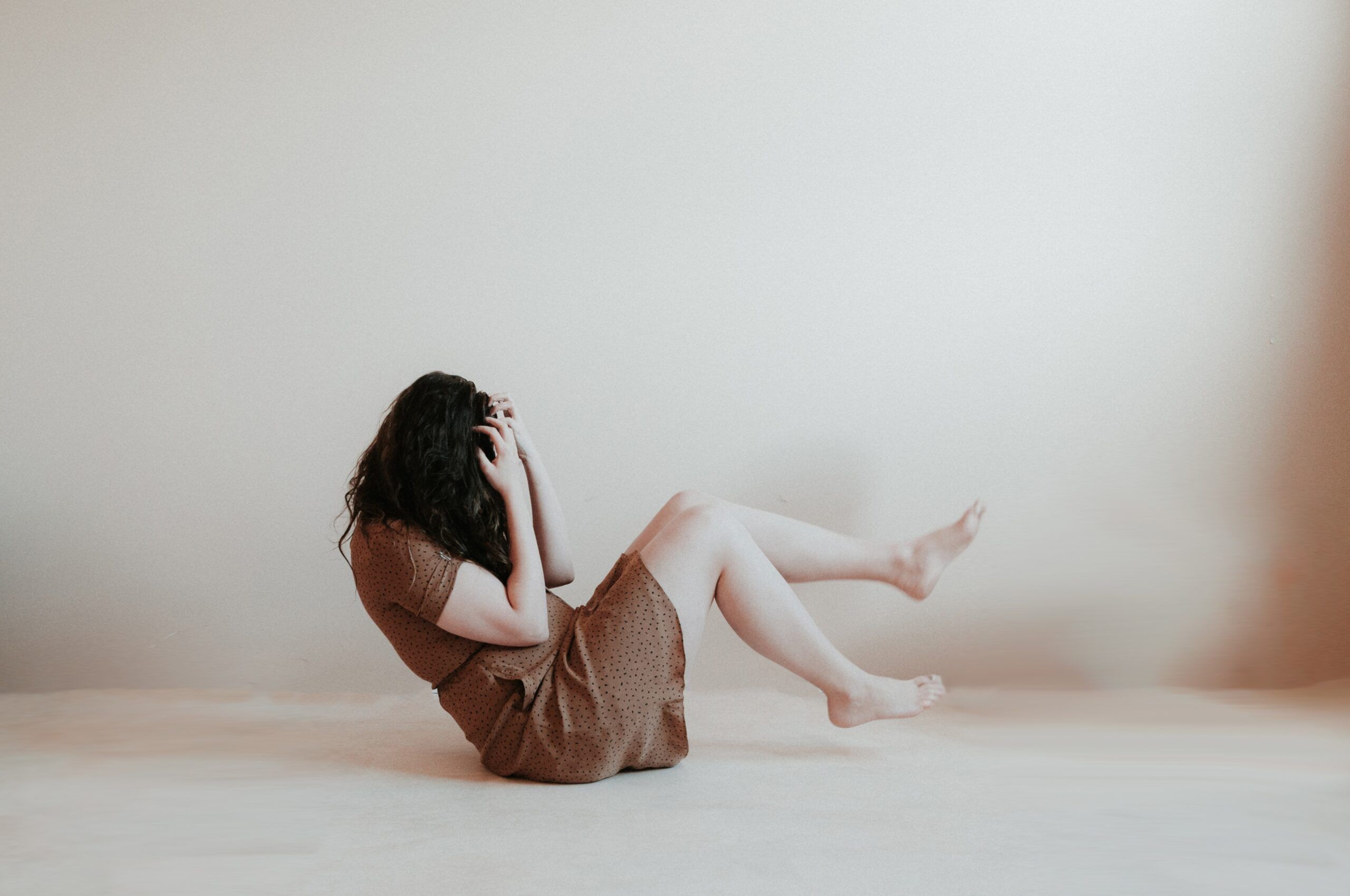 A woman is seen covering her face