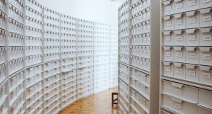 a photo of a hall of white archive boxes