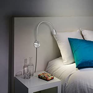 a photo of a wall-mounted silver reading lamp with gooseneck