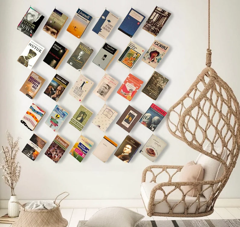 Image of six rows of books hanging on a wall. 