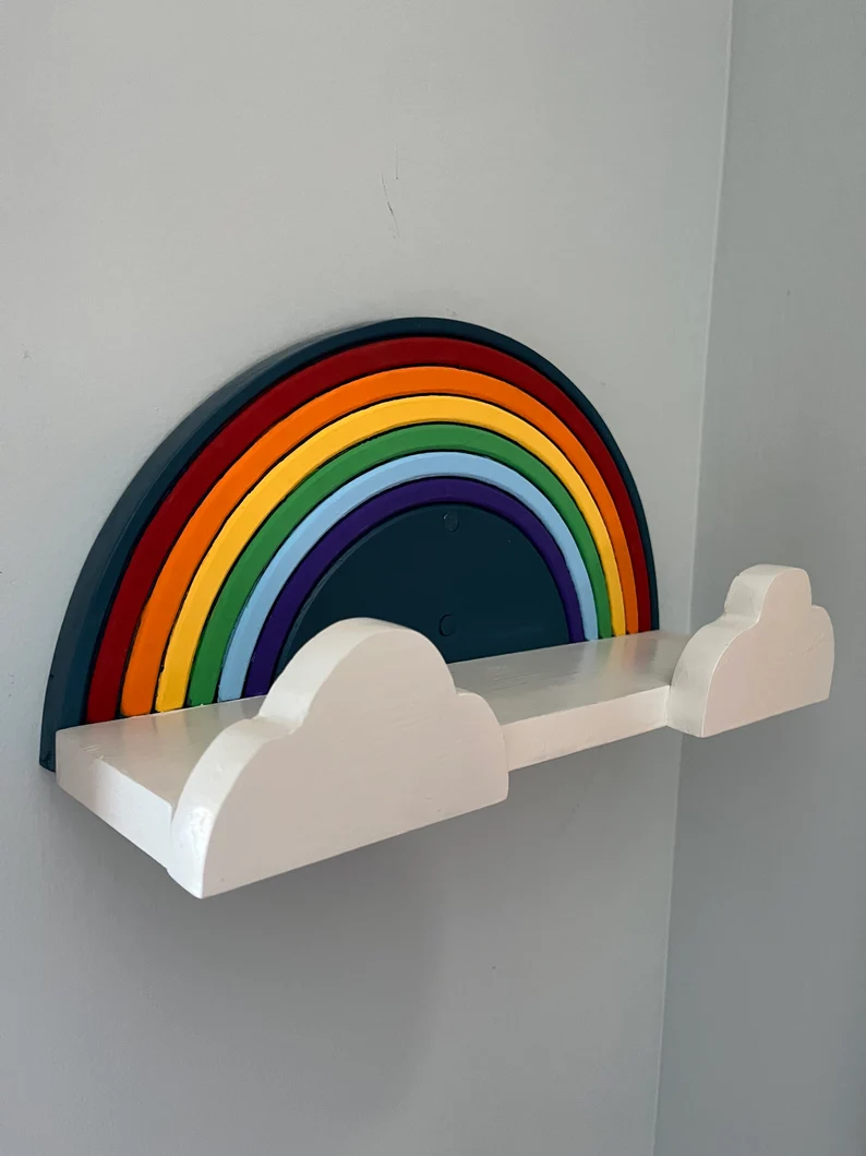Image of a single bookshelf in the shape of a rainbow