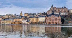 a photo of building in Sweden with reflections in the water