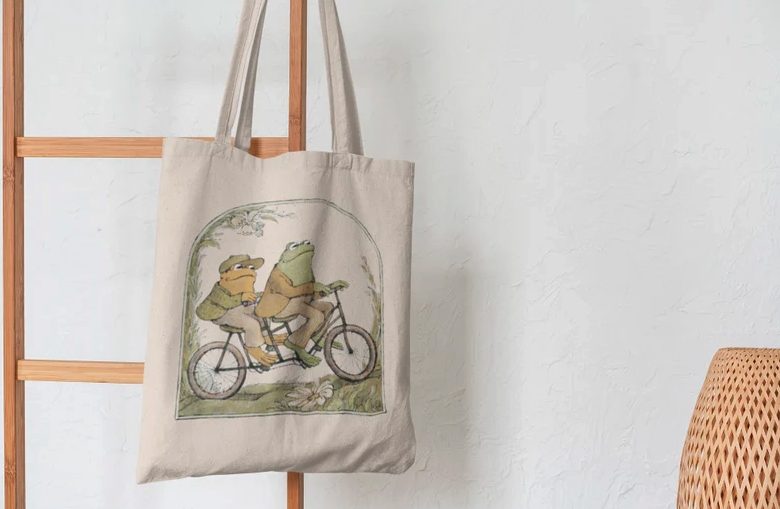 Frog and Toad canvas bag hanging on wooden ladder