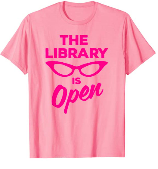 Pink t-shirt with "The library is open" screenprinted on it with the outline of cat eye glasses