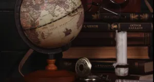 antique looking set up with globe, books, etc.