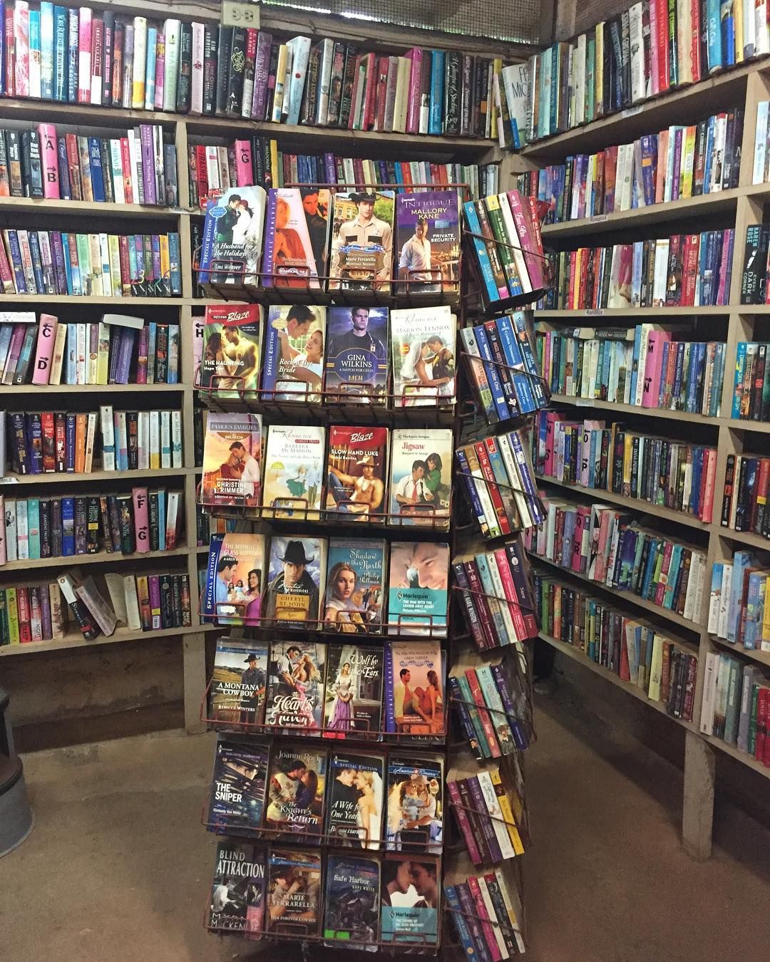 a spinner rack at a used book store