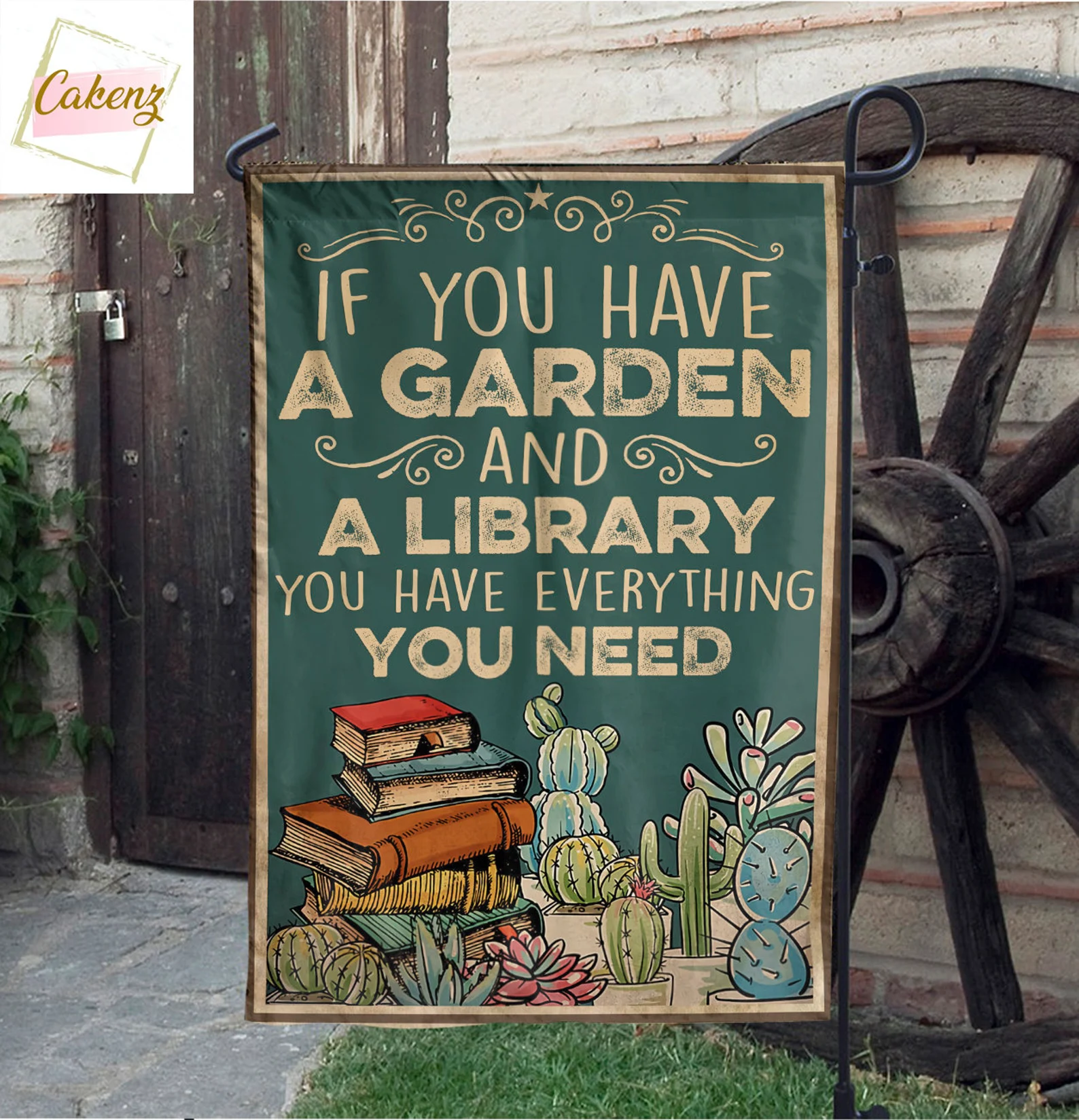 A green flag showing the quote below in large capital letters, a colorful stack of books, and several cacti of different shapes and sizes.