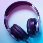 image of headphones on blue and purple background