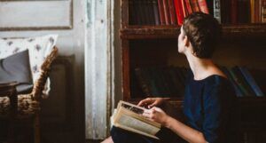 image of a person looking at a bookshelf