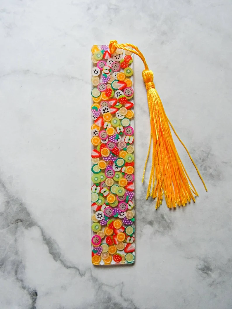 Image of a resin bookmark covered in colorful fruit.