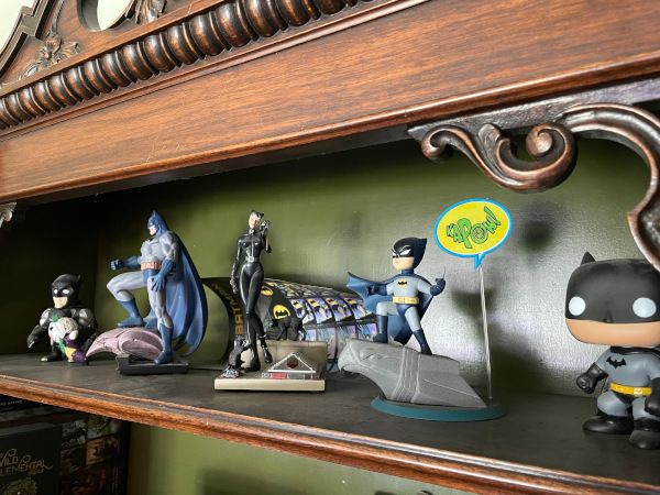image of several Batman collectibles on a shelf