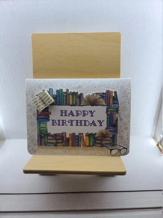 Happy birthday card with books and glasses.