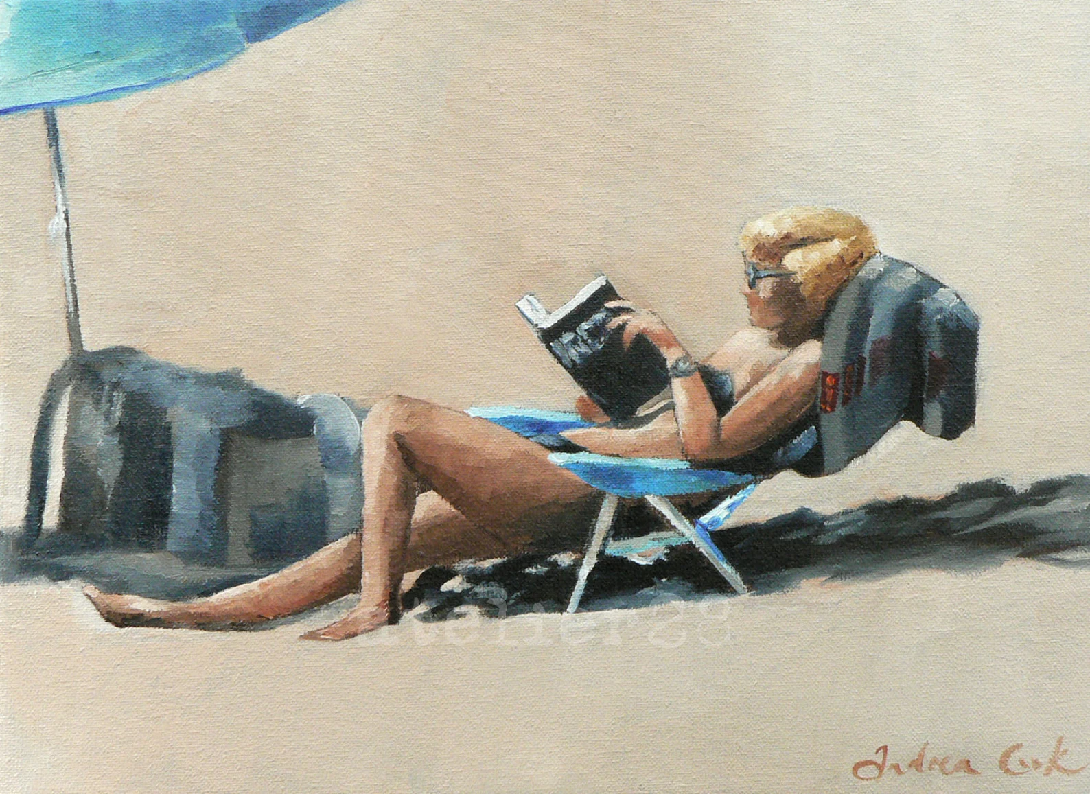 Print of a woman reading a book on the beach.