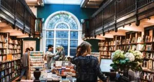 bookstore full of people and shelves filled with books